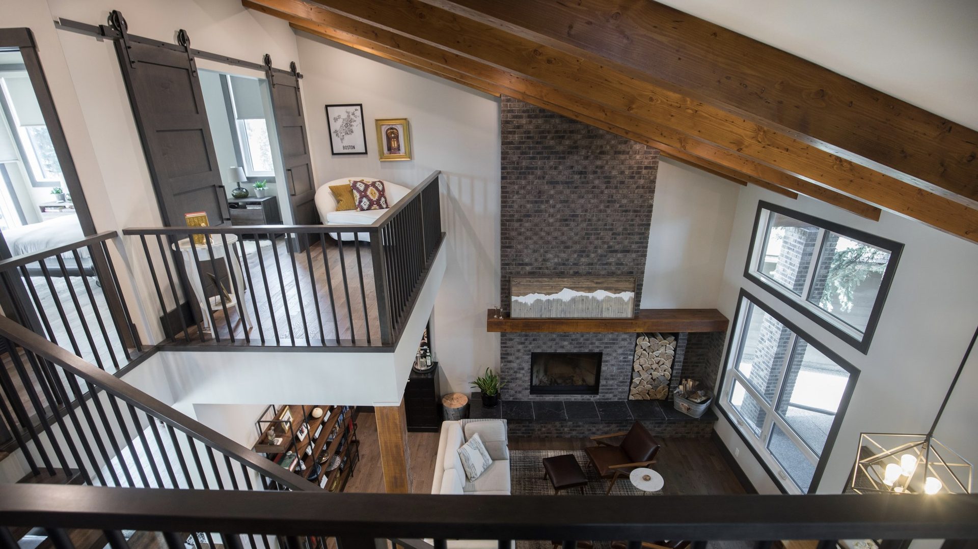 Fish Creek Park estate — loft with timber beams and iron railings